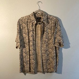 Short sleeved button-up patterned shirt